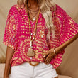 Top holgado de mujer con cuello en V y estampado, con mangas murciélago, ideal para vacaciones.