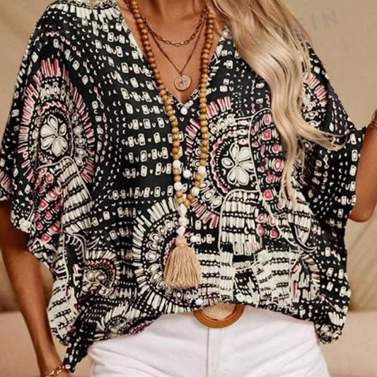 Top holgado de mujer con cuello en V y estampado, con mangas murciélago, ideal para vacaciones.
