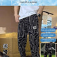 Pantalones cortos informales con abertura lateral y estampado de seda helada para hombre (50% de descuento)