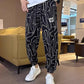 Pantalones cortos informales con abertura lateral y estampado de seda helada para hombre (50% de descuento)